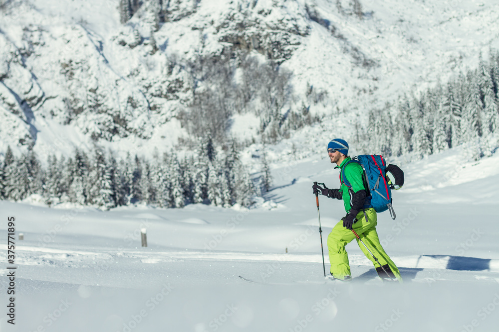 Ski tourer in austian winter landscape Ski tourer in austian winter landscape