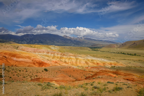 Amazing natural phenomenon-Martian landscapes in the Altai mountains. Multicolored rocks against a blue sky with white clouds. Futuristic panoramic picture, background image. Mars.