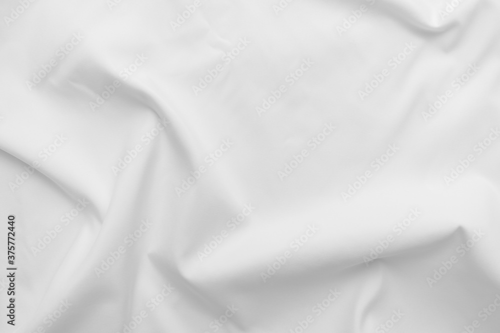 Abstract white fabric texture background. Cloth soft wave. Creases of satin, silk, and cotton. Abstract white fabric texture background. Cloth soft wave. Creases of satin, silk, and cotton.