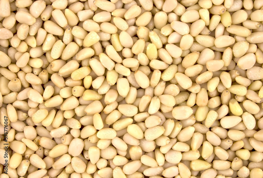 Background texture of shelled pine nuts. Background texture of shelled pine nuts.