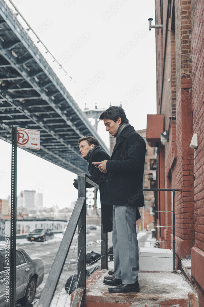 Friends Hanging Out in Dumbo Brooklyn on a Winter Afternoon Friends Hanging Out in Dumbo Brooklyn on a Winter Afternoon