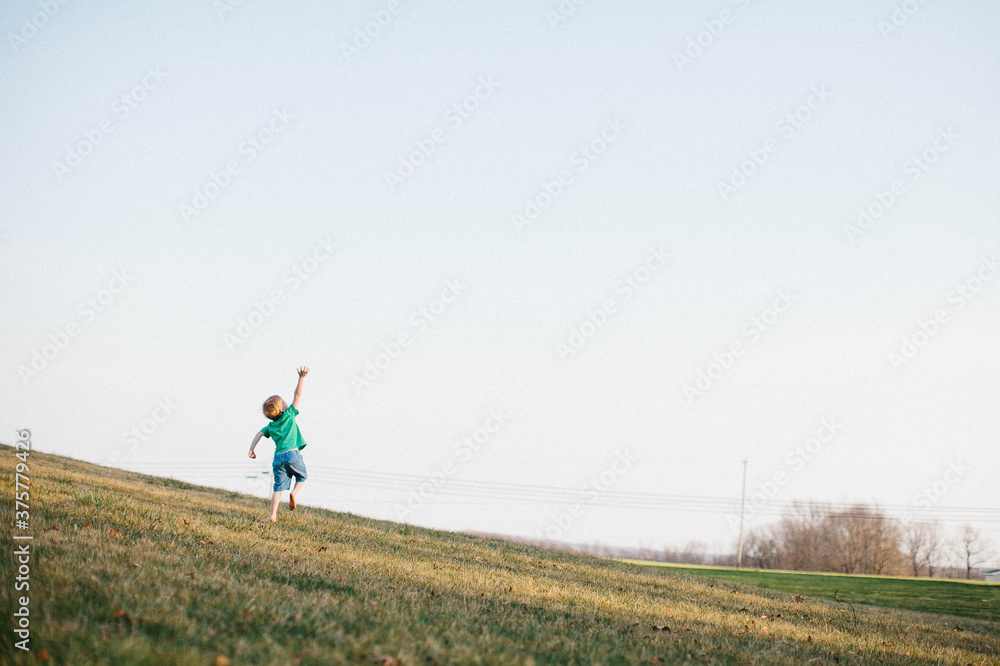 Young boy jumping for the sky Young boy jumping for the sky