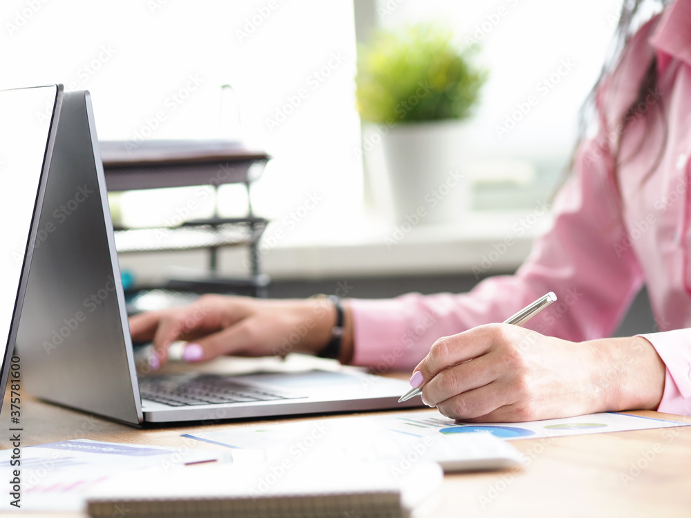 Fototapeta premium Office manager click on laptop keyboard close up