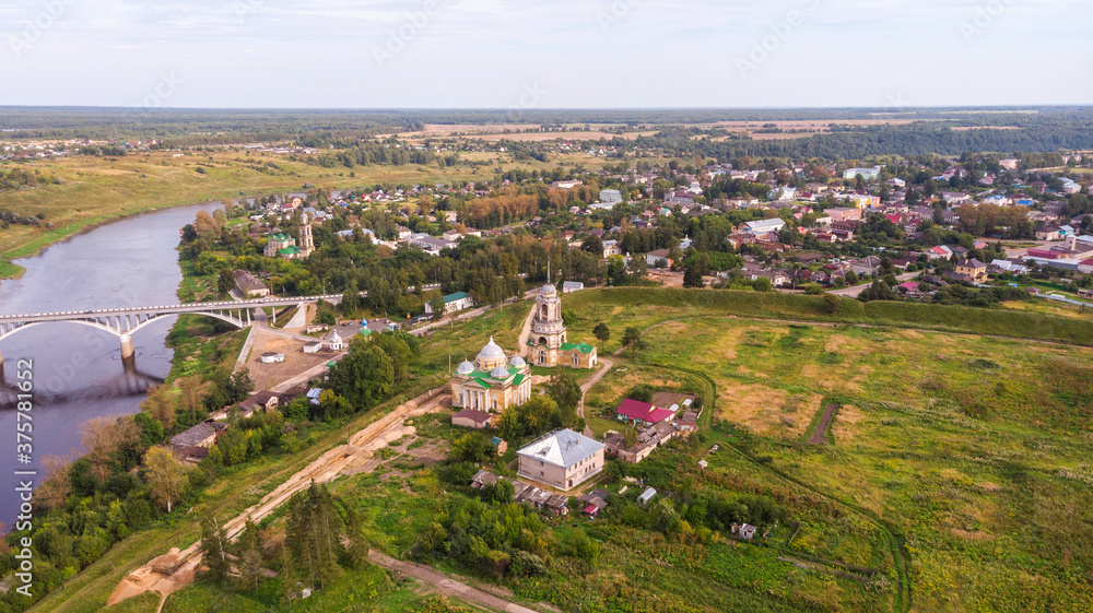 Picturesque view of small ancient town Staritsa with Boris and Gleb Cathedral on the Volga River in Russia.