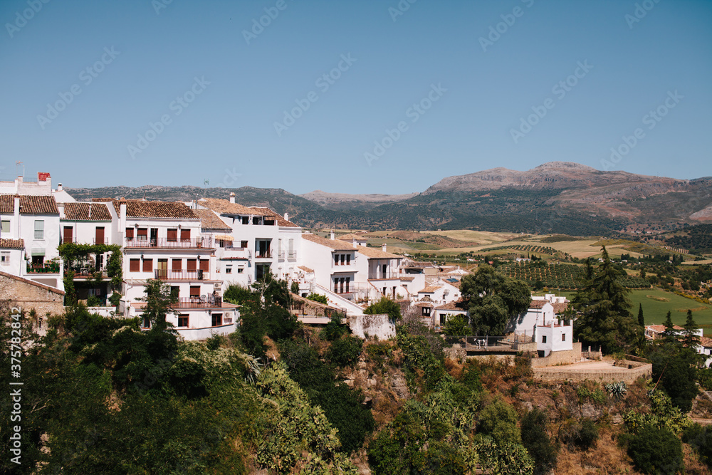 White homes on a cliff in a small town of Ronda, Spain White homes on a cliff in a small town of Ronda, Spain