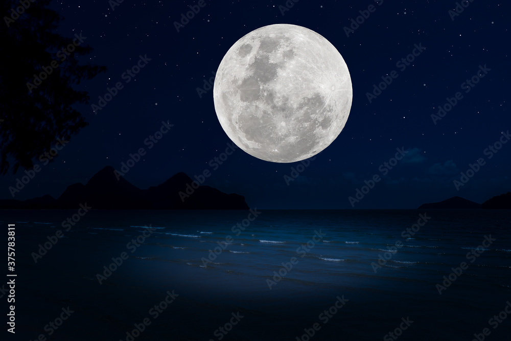 Full moon with silhouette mountain and sea in the night. Full moon with silhouette mountain and sea in the night.