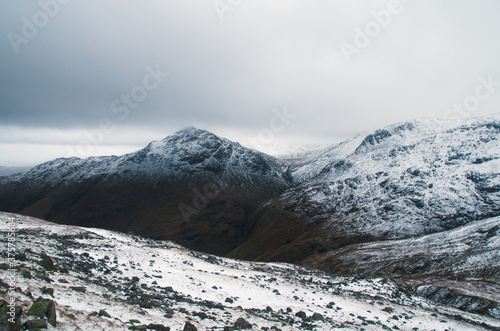 Fading snow line in the mountains photo