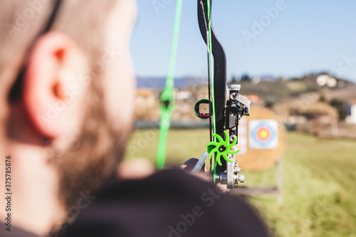 Archer Aims at Target with Viewfinder photo