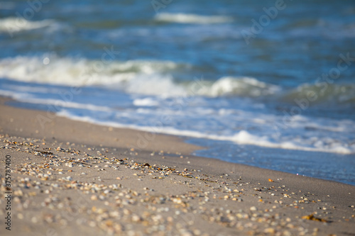 closeup sandy sea beach with vawes