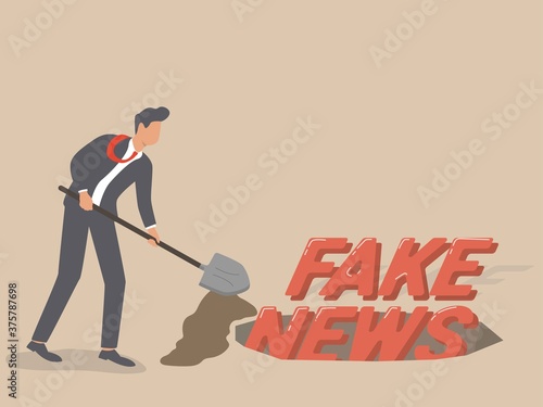 Stop fake news and misinformation spreading on internet and media concept, bisnisman mengubur kata fake news ditanah