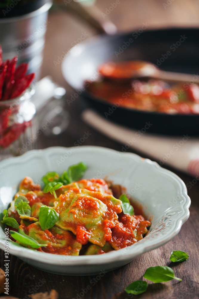 Ravioli with tomato sauce and fresh basil Ravioli with tomato sauce and fresh basil