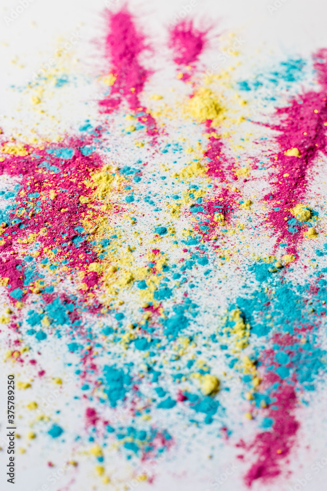 Colorful holi powder on white background Colorful holi powder on white background