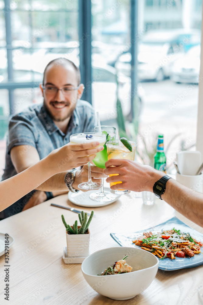 Group Of People Making A Toast At The Restaurant Group Of People Making A Toast At The Restaurant
