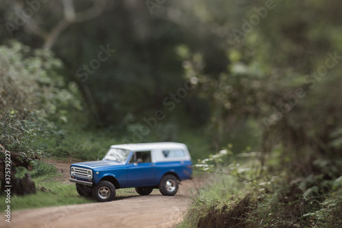 Tilt shift shot of a vintage off-road 4x4 truck photo