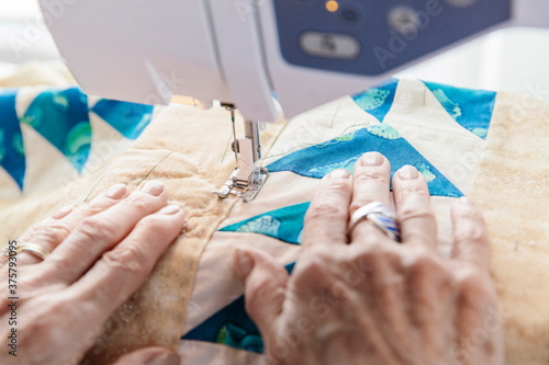 Senior Woman Sewing photo