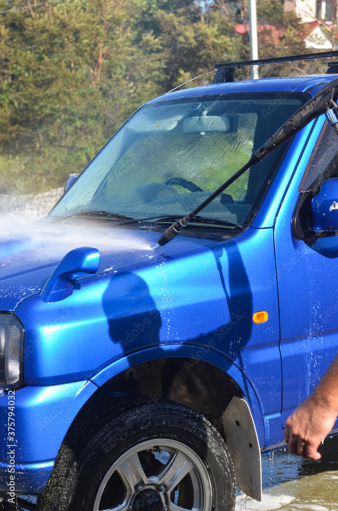 Fototapeta premium car wash with foam auto service concept