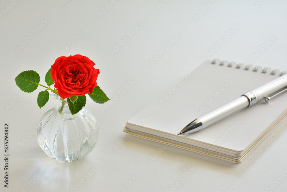 Rose flower on a notebook Rose flower on a notebook