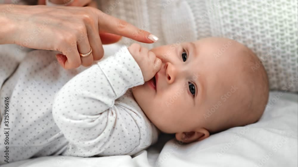 Cute toddler thumb sucking lying on bed trying sleeping. Shot on RED Raven 4k Cinema Camera Cute toddler thumb sucking lying on bed trying sleeping. Shot on RED Raven 4k Cinema Camera