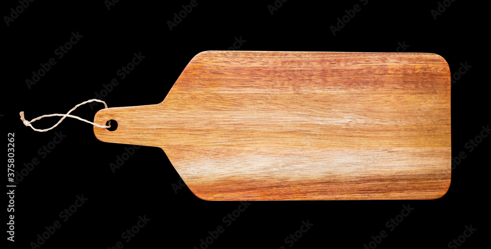 Wooden cutting board isolated on black