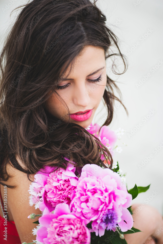 Young woman with peonies Young woman with peonies