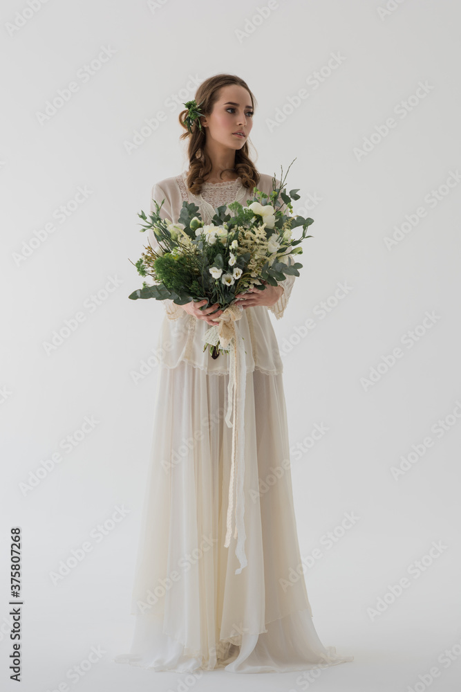 Beautiful woman wearing floor lenght wedding dress Beautiful woman wearing floor lenght wedding dress