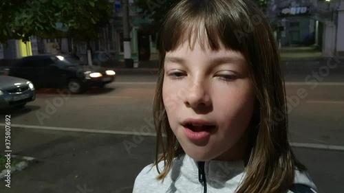 Beautiful teen girl inflating bubble of chewing gum. Moderm fashion girl.