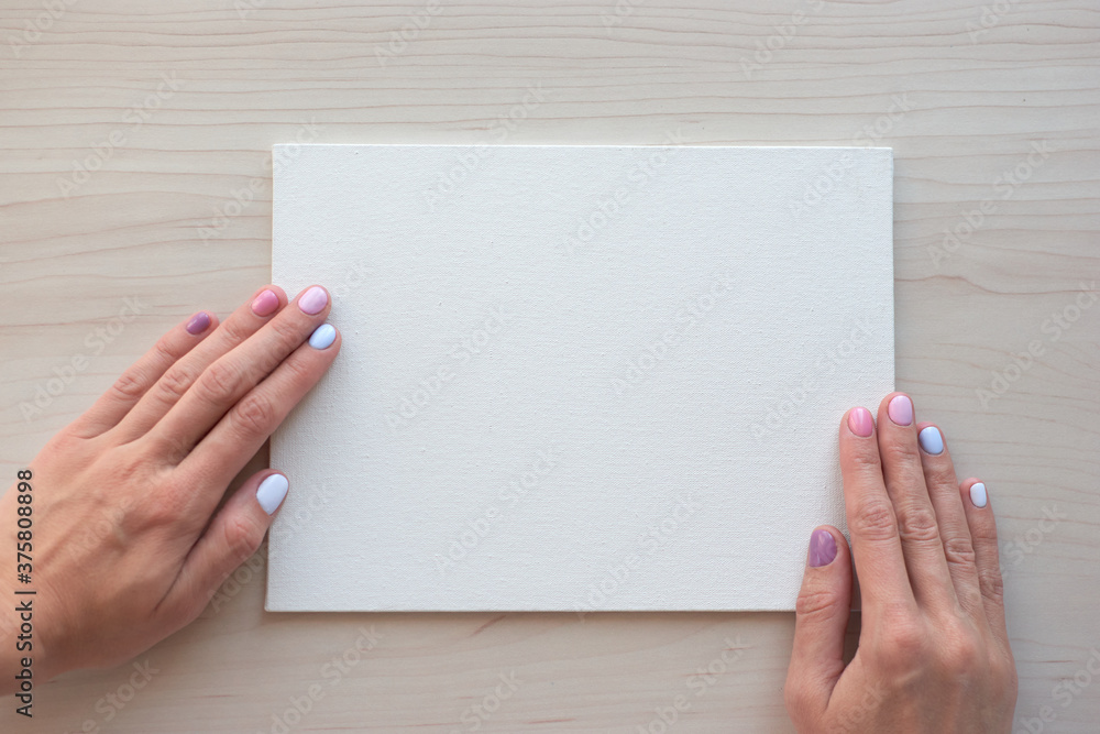 White board with hands for copy space. School office supplies on wooden background. Back to school concept. Top view ready for your design White board with hands for copy space. School office supplies on wooden background. Back to school concept. Top view ready for your design