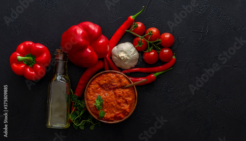 Traditional Balkan vegetable caviar. Harvesting cooking. Roasted Red Pepper Relish ajvar or aivar with ingredients.