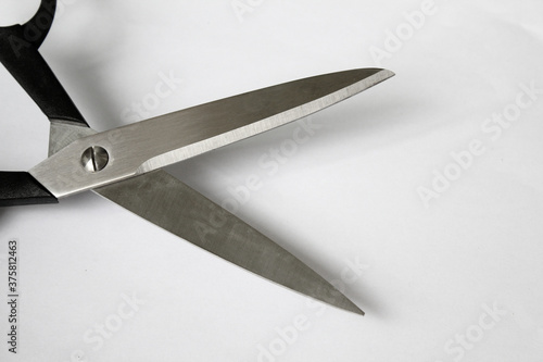 Scissors hand-operated cutting instruments. Scissors for cutting paper and thin materials, object is isolated on white background .