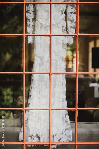 Lace wedding dress in window photo