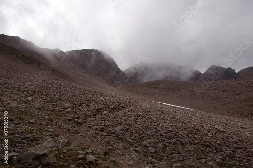 Mountain range in the clouds. Mountain pass in the fog. Yakov pass (3394 meters above sea level), Caucasus.