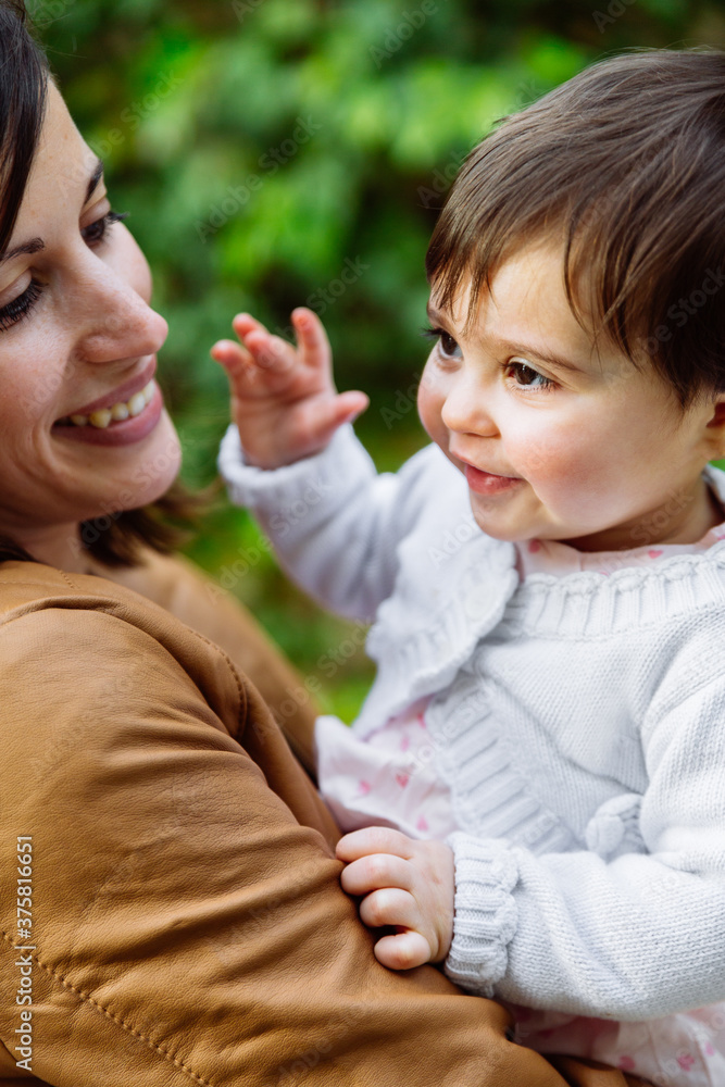 Young woman mother playing with her baby girl daughter Young woman mother playing with her baby girl daughter