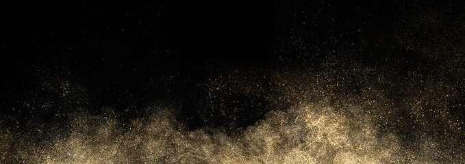 Gold glitter powder splash on black background