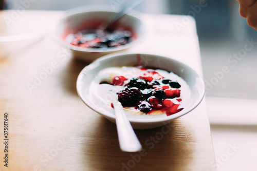 Continental Breakfast with Yogurt , Raspberries and Honey photo