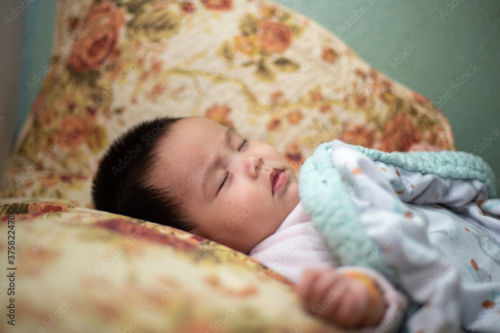 Obraz premium baby sleeping in bed