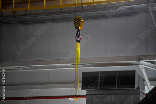 Swivel chain hook of electric hoist in workshop, chain block, pullersSwivel chain hook of electric hoist in workshop, chain block, pullers photo