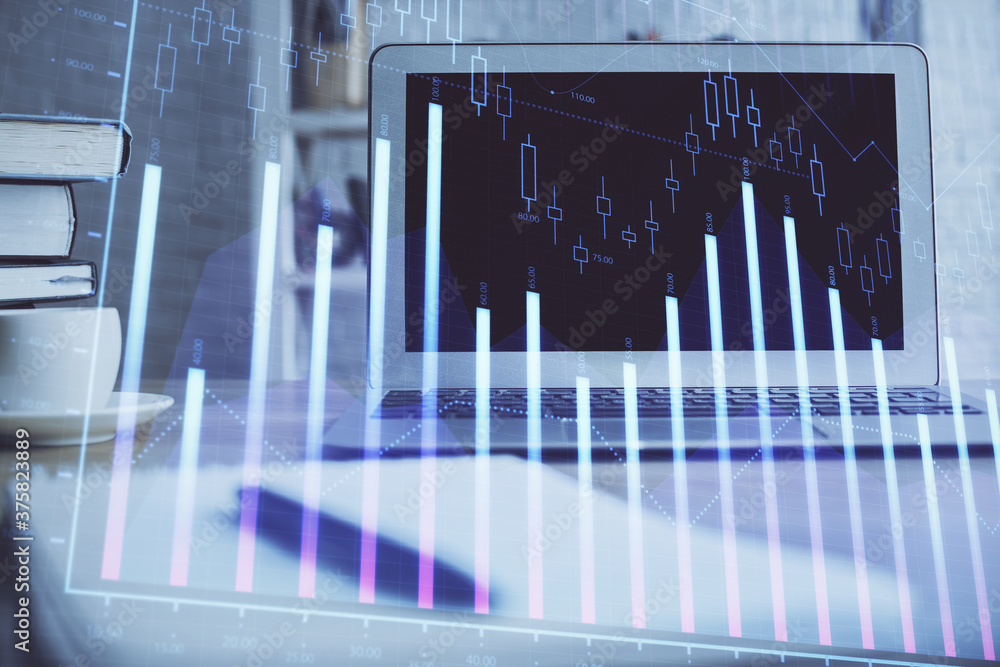 Stock market chart hologram drawn on personal computer background. Double exposure. Concept of investment. Stock market chart hologram drawn on personal computer background. Double exposure. Concept of investment.