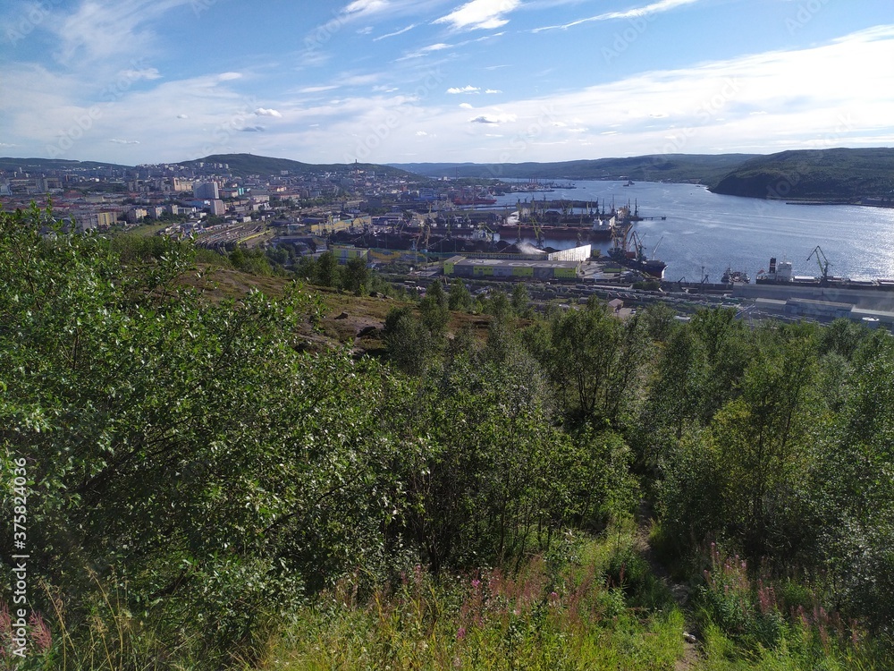 View of the Kola Bay and the city Murmansk from a high hill in aummer