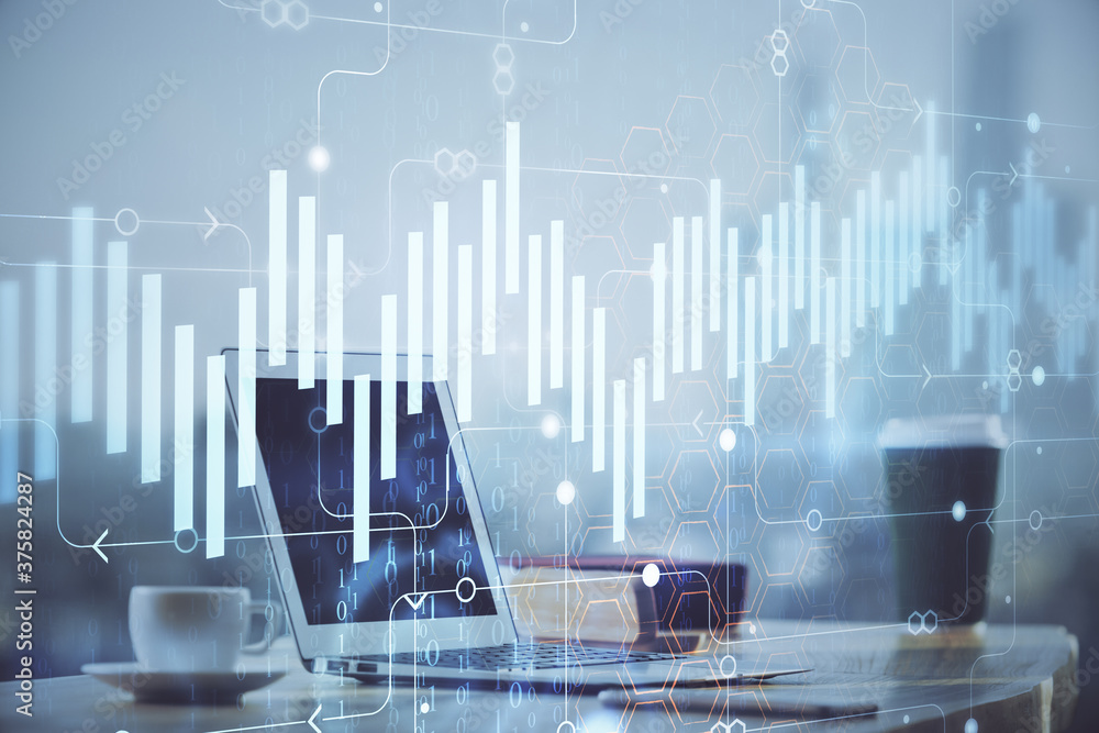 Forex Chart hologram on table with computer background. Double exposure. Concept of financial markets. Forex Chart hologram on table with computer background. Double exposure. Concept of financial markets.