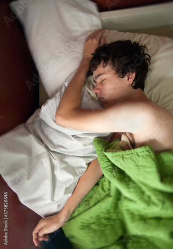 Young Man Sleeping View From Top photo