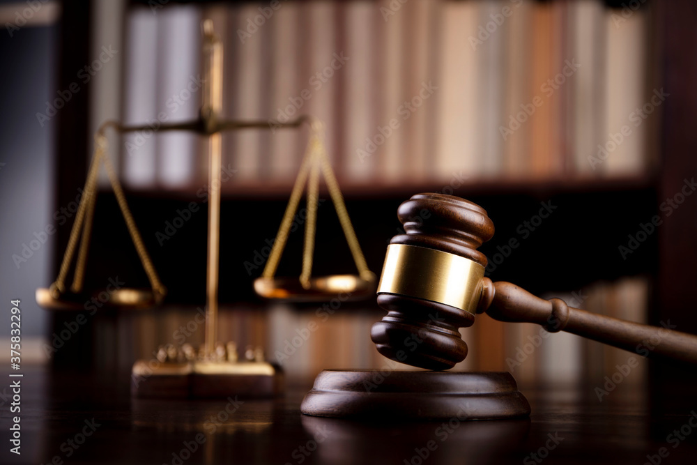 Judge‘s gavel on bookshelf background. Judge office. Judge‘s gavel on bookshelf background. Judge office.
