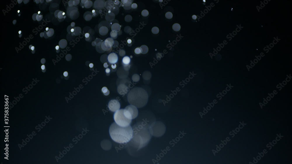 Shower douche and Droplet infection concept overlay mockup plate shot of downpour water droplets with strong bokeh blur. Fountain of drops in soft selective macro focus against black background. Shower douche and Droplet infection concept overlay mockup plate shot of downpour water droplets with strong bokeh blur. Fountain of drops in soft selective macro focus against black background.
