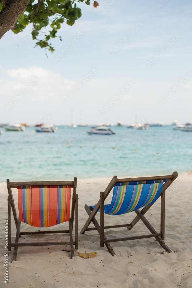 Two Deckchairs On The Sandy Beach Two Deckchairs On The Sandy Beach