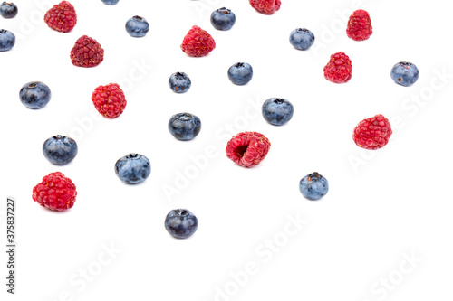 raspberries and blueberries isolated on white background