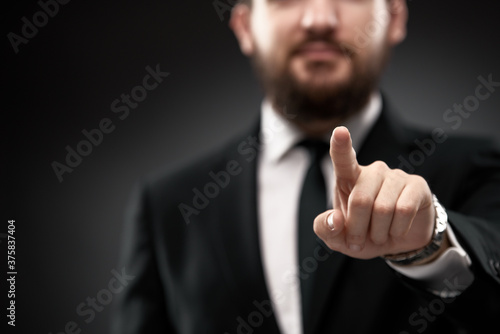 Businessman pointing finger forward