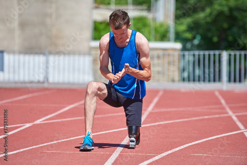 Sportsman with prosthetic foot preparing for jogging