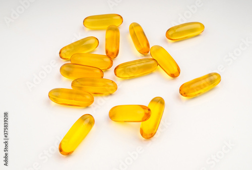 Evening primrose oil capsule on white background, supplementary food. fish oil