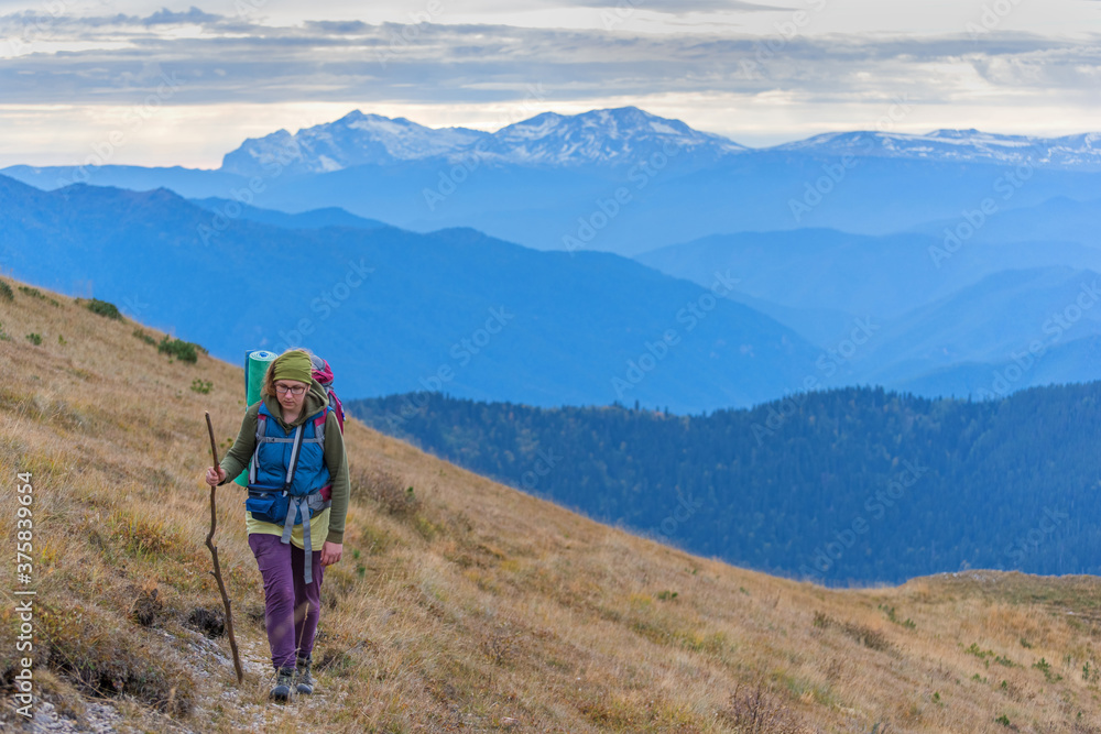 A women walking mountain path A women walking mountain path