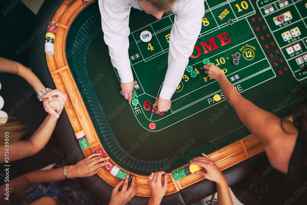 © Sean Locke Photography/Stocksy - Casino: Dealer Making Payouts At Craps Table © Sean Locke Photography/Stocksy - Casino: Dealer Making Payouts At Craps Table