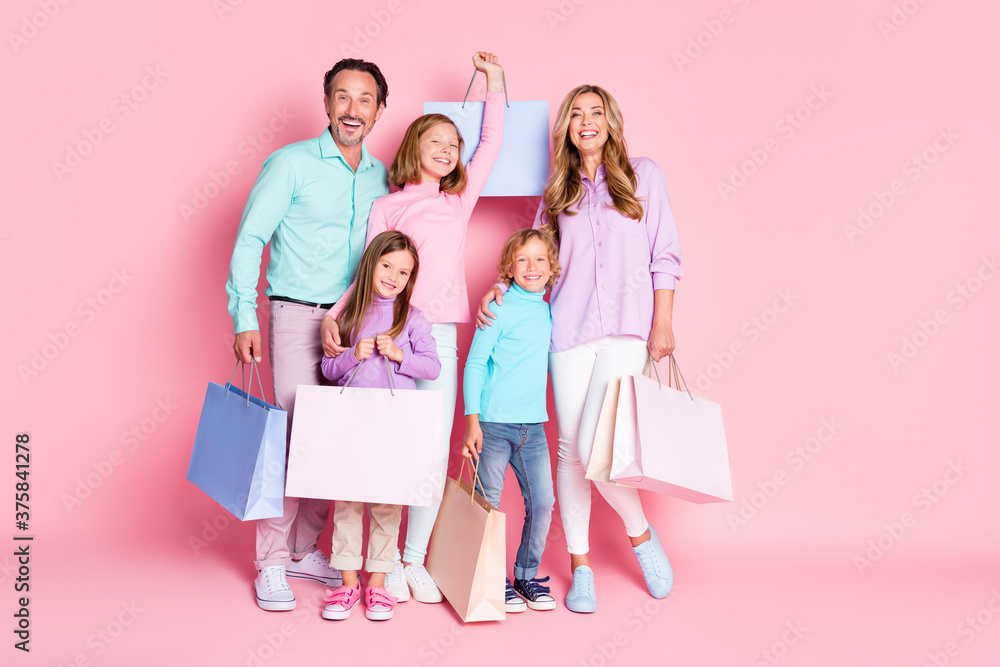 Everyone go shopping center incredible family sales. Full length photo mom mommy daddy dad enjoy spend time together buy purchase hold bags isolated pastel color background Everyone go shopping center incredible family sales. Full length photo mom mommy daddy dad enjoy spend time together buy purchase hold bags isolated pastel color background